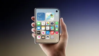 A hand holds a futuristic foldable smartphone displaying an iOS-style home screen with weather and maps widgets.