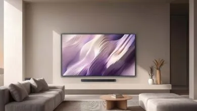 Modern living room featuring a wall-mounted TV with a purple abstract display and a soundbar below.