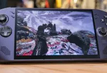 Close-up of a purple Lenovo Legion handheld gaming console running a vibrant fantasy video game.
