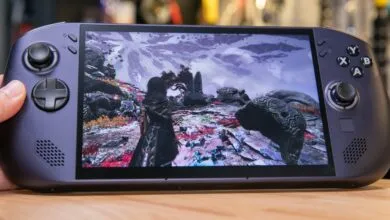 Close-up of a purple Lenovo Legion handheld gaming console running a vibrant fantasy video game.