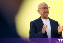 Marc Boroditsky, Nebius Chief Revenue Officer, speaking on stage with a yellow background.