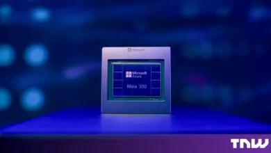 Close-up of the Microsoft Azure Maia 300 AI processor chip glowing under blue light.