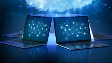 Laptops displaying glowing data networks against a blue digital background.
