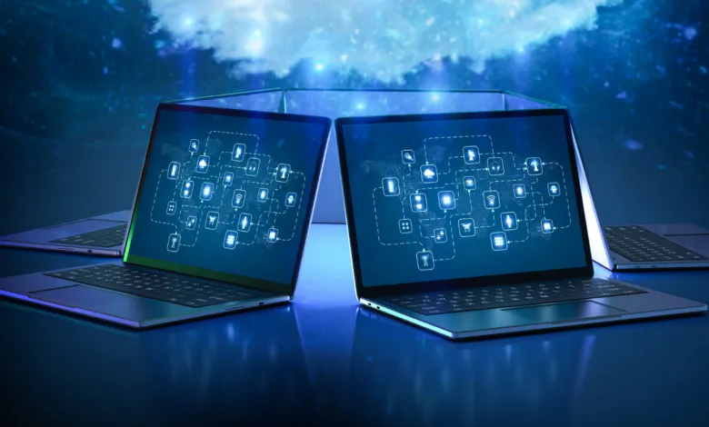 Laptops displaying glowing data networks against a blue digital background.