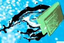 A green wallet splashes against a bright blue background with black liquid spraying outward.