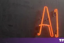 Bright orange neon AI letters mounted on a dark grey circuit board pattern background.