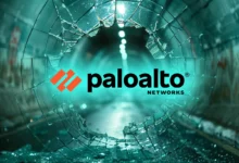 Palo Alto Networks logo superimposed on shattered glass overlooking a glowing tunnel.