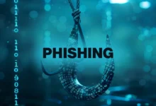 A cyber security concept image featuring a metallic fishhook overlaid with digital code and the word PHISHING.