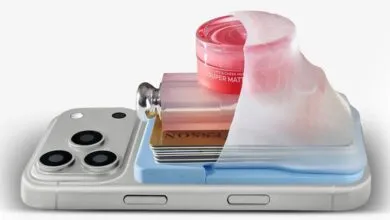 Silicone phone pouch attached to the back of a smartphone, holding cards and cosmetics.