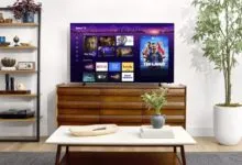 Modern living room featuring a Roku TV on a wooden console with streaming apps displayed.