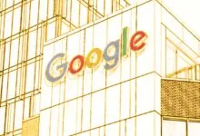 The Google logo displayed on the exterior facade of a modern corporate office building