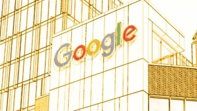 The Google logo displayed on the exterior facade of a modern corporate office building