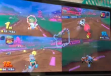 Four-player split-screen gameplay of Mario Kart on a tablet screen